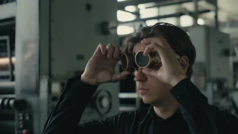 Stack of footage: Man puts on a steampunk glasses and looks around Stockbeeldmateriaal 149827114