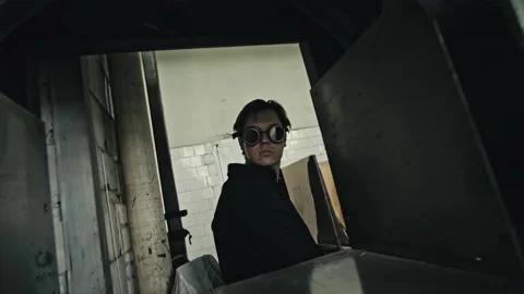 Stack of footage: Man on a steampunk glasses and looks around. Camera moves Stockbeeldmateriaal 149827314