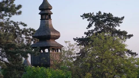 Stack of footage: Sunset over an old wooden church. The church was built without 스톡 동영상 134649249