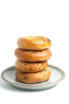 Stack Of Four Bagels On Ceramic Breakfast Plate Stock Photos