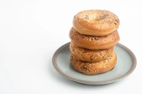 Stack Of Four Bagels On Ceramic Breakfast Plate Stock Photos