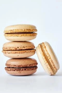 Stack of four brown French Macarons, cakes with coffee and creme brulee flavor 写真素材