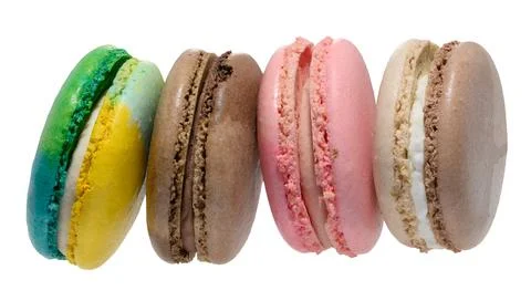 Stack of four colorful macarons blue, yellow, brown, and pink. Dessert on a.. Stock Photos