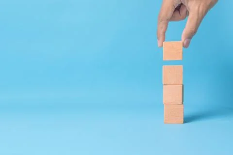 Stack of four empty wooden cubes. Symbolizing foundation, growth, decision .. Stock Photos