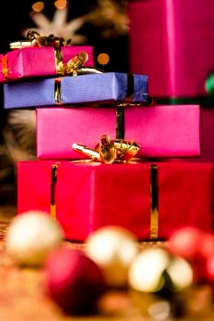 Stack of four presents and spheres. Stock Photos
