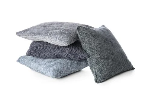 Stack of four textured gray and blue decorative throw pillows for home decor  Stock Photos