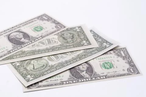 Stack of Four United States One Dollar Bills on White Background, Currency,.. Stock Photos