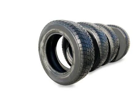 Stack of four wheel new black winter tyres for car 스톡 사진