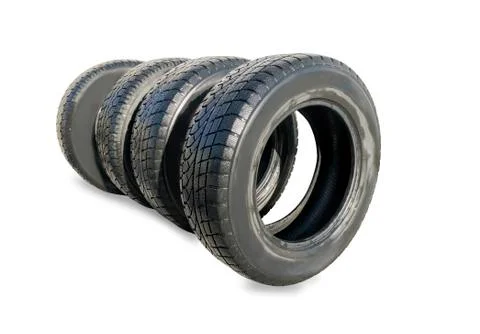 Stack of four wheel new black winter tyres for car Stock Photos