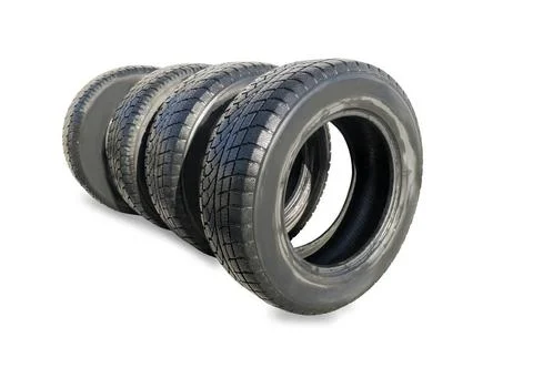Stack of four wheel new black winter tyres for car Stack of four wheel new... Stock Photos