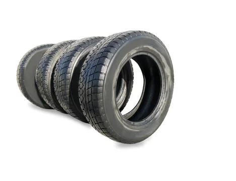 Stack of four wheel new black winter tyres for car Stack of four wheel new... Stock Photos