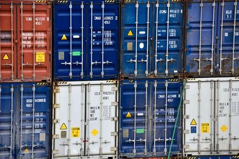 Stack of Freight shipping containers at the docks Stock Photos