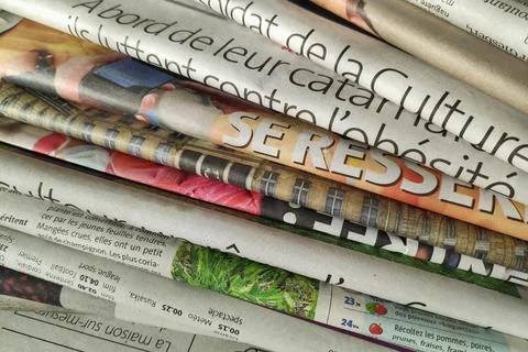 Stack of French newspapers Stock Photos