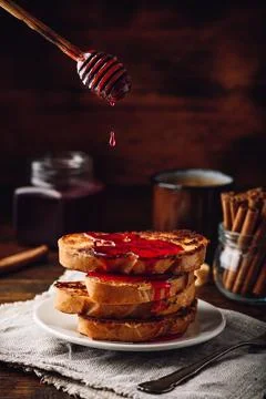 Stack of french toasts with berry syrup Stock Photos