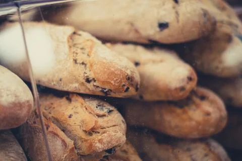 Stack of fresh baguette bread closeup for sale at bakery   - Stock Photos