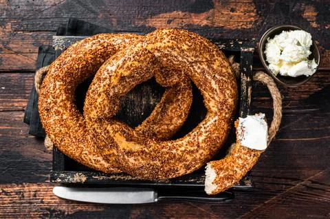 Stack of fresh baked Turkish simit bagel with kaymak. Wooden background. To.. Stock Photos
