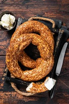 Stack of fresh baked Turkish simit bagel with kaymak. Wooden background. To.. Stock Photos