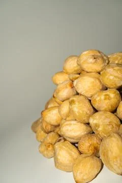 Stack of fresh candlenuts, Indonesian traditional cooking ingredient Fotos de archivo