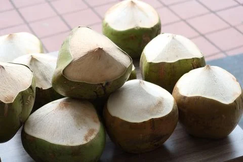 Stack of fresh coconut display for sale Stock Photos