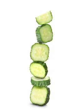 Stack of fresh cucumber pieces isolated on white Foto stock