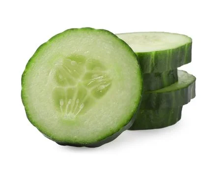 Stack of fresh cut cucumber isolated on white Foto stock