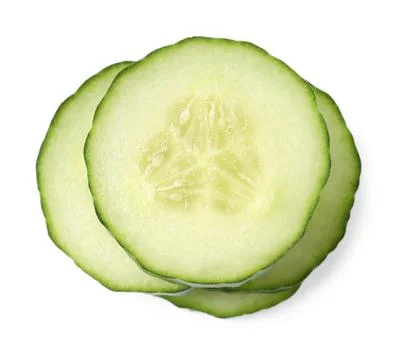 Stack of fresh cut cucumber isolated on white, top view Stock Photos