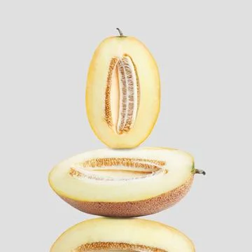 Stack of fresh cut melons on light grey background 스톡 사진