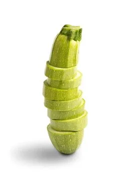 Stack of fresh green zucchini slices on white background Stock Photos