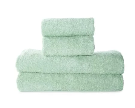 Stack of fresh light towels isolated on white Stock Photos