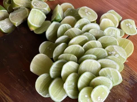 Stack of Fresh Lime Slices in top view. Fresh lime as a cooking flavoring Stock Photos