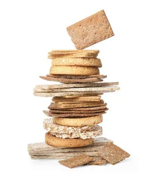 Stack of fresh rye crispbreads, crunchy rice cakes and rusks on white backg.. Stock Photos