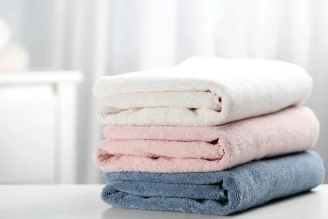 Stack of fresh soft towels on table 스톡 사진