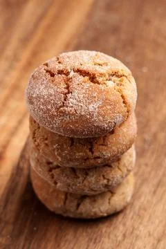 Stack of fresh sugar ginger cracked cookies on wooden table Stock Photos