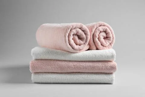 Stack of fresh towels on light background 스톡 사진