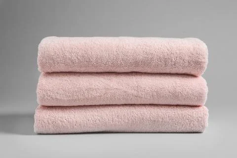 Stack of fresh towels on light background 스톡 사진