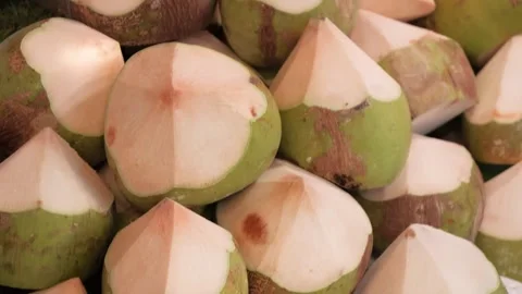 Stack of Fresh Young Green Coconuts Trimmed and Cut Open at Local Market Stockbeeldmateriaal 345639349