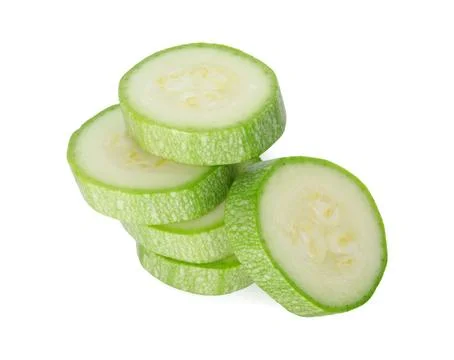 Stack of fresh zucchini pieces isolated on white 스톡 사진