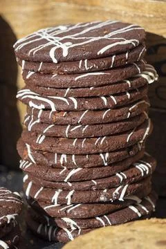 Stack of  freshly baked dark chocolate cookies with icing sugar 스톡 사진