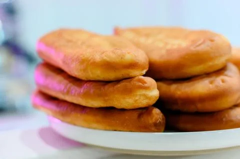 Stack of freshly baked flatbreads on a white plate with soft texture Stock Photos