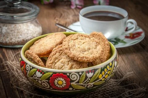 Stack of freshly baked oat biscuits in a bowl. Stock Photos
