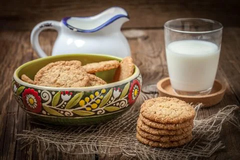 Stack of freshly baked oat biscuits in a bowl. 写真素材