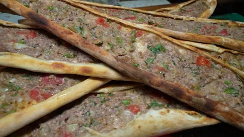 Stack of Freshly Baked Turkish Minced Meat Pide (Kıymalı Pide) Stock Footage 323182719