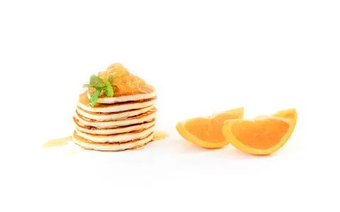Stack of freshly home made pancakes isolated over white background with two Stock Photos