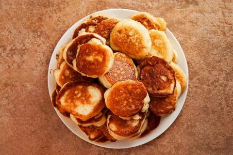 Stack of fried pancakes on a white plate Stock Photos