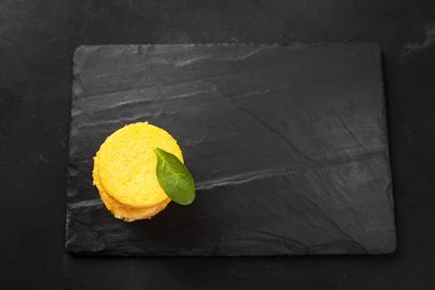 A Stack of Fried Polenta Discs, copy space for your text on the dark background Photos