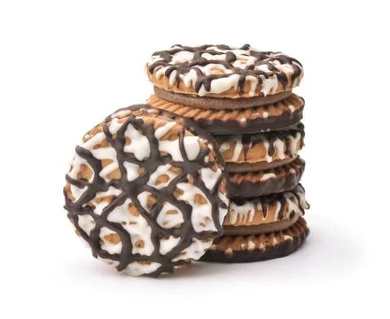 Stack of frosting drizzled round cookie Stack of frosting drizzled round c... Fotos de archivo