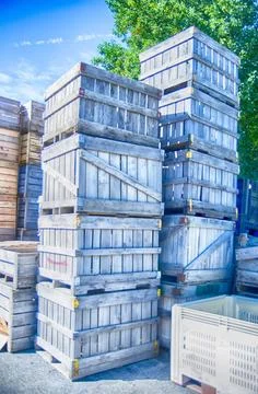 Stack of fruit boxes or crates sit outside a warehouse Stack of fruit boxe... Stock Photos
