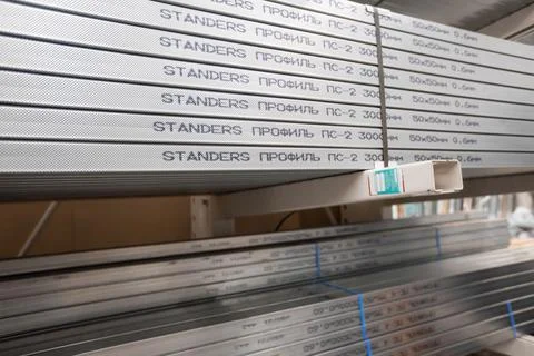 Stack of galvanized rectangular steel pipes for building materials. Production Stock Photos
