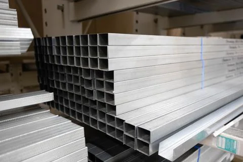 Stack of galvanized rectangular steel pipes for building materials. Production Stock Photos