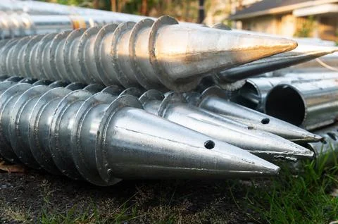Stack of galvanized screw piles for house foundation Fotos Stock